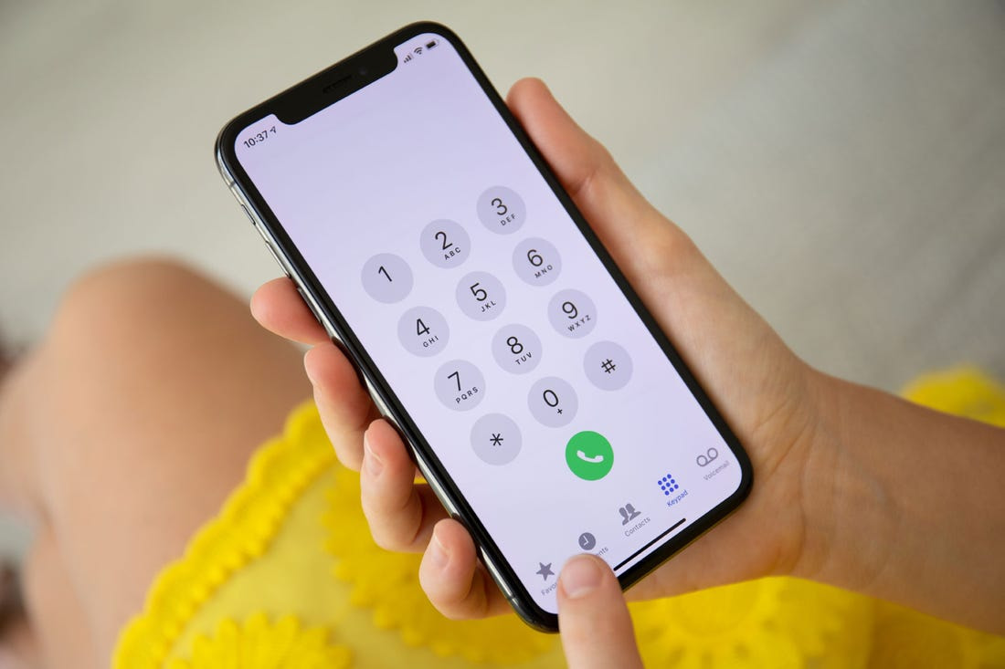 How to dial an extension number on iPhone and Android